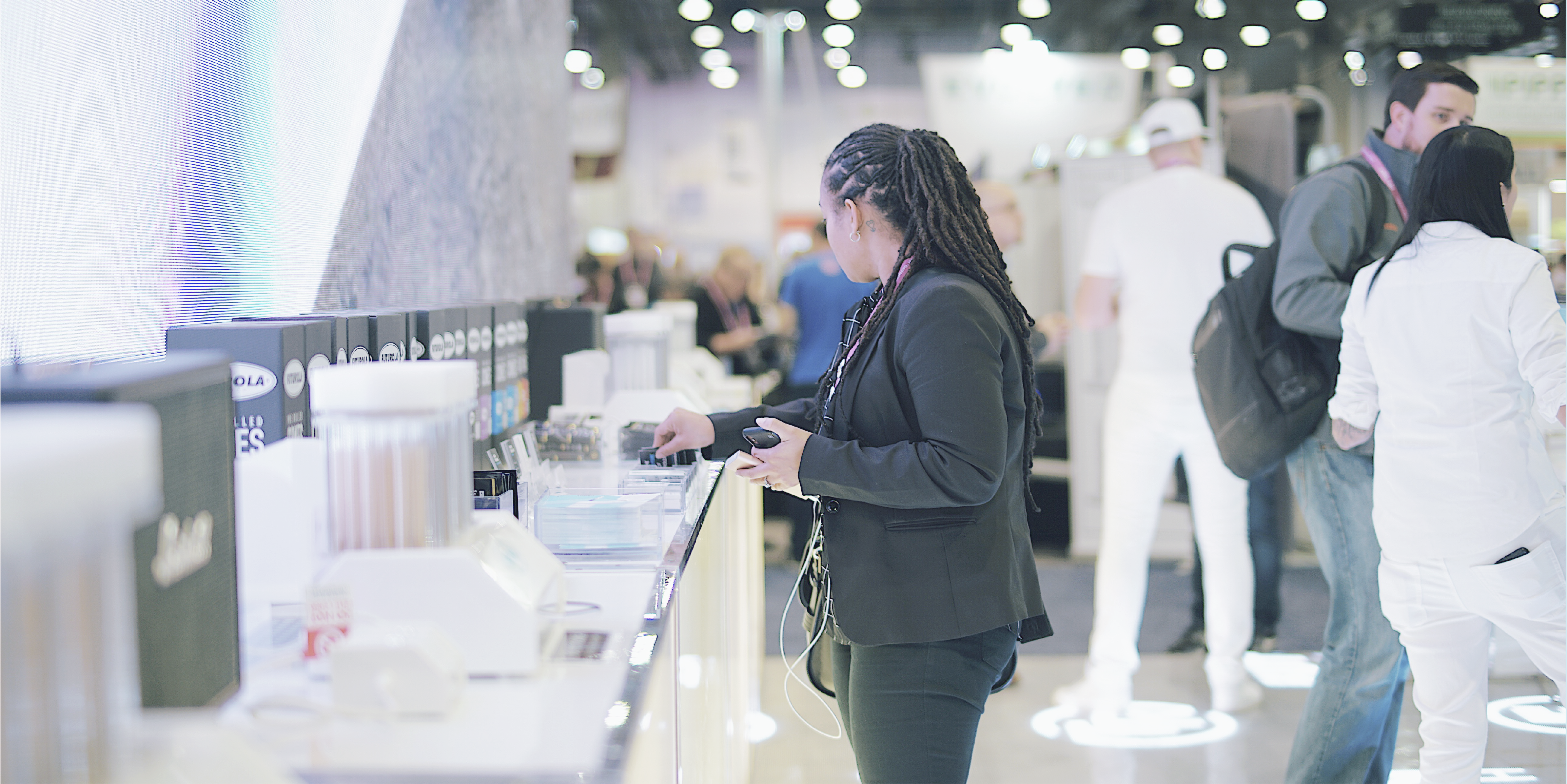 Futurola trade show booth showcasing premium pre-rolled cones and rolling accessories for industry professionals.